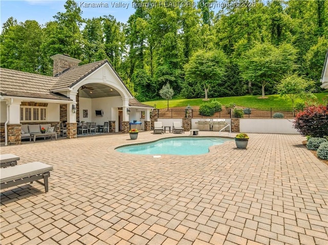 948 Little Coal River Rd, Alum Creek, WV 25003 - view of swimming pool with a patio, an outdoor living space, and view of scattered trees
