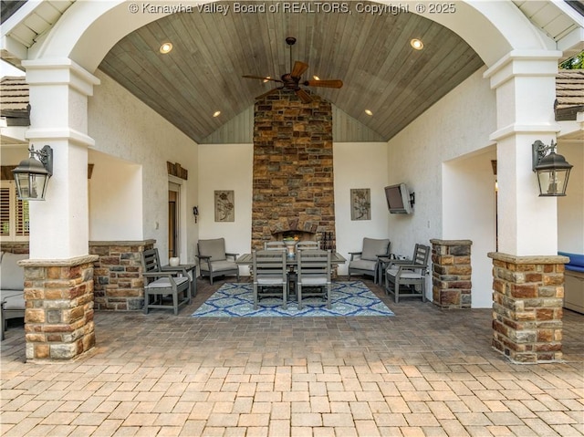 948 Little Coal River Rd, Alum Creek, WV 25003 - view of patio / terrace with an outdoor living space with a fireplace and ceiling fan