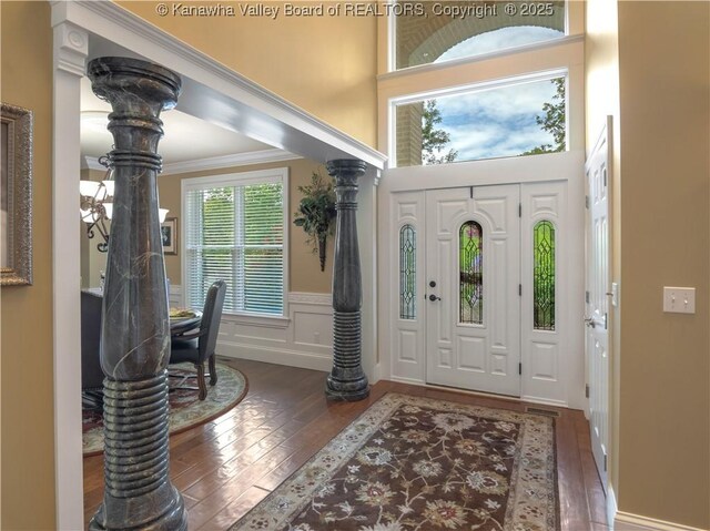 948 Little Coal River Rd, Alum Creek, WV 25003 - entryway with hardwood / wood-style flooring, a wainscoted wall, a decorative wall, and ornamental molding