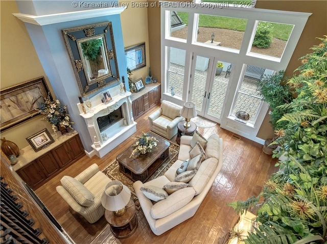 948 Little Coal River Rd, Alum Creek, WV 25003 - living area featuring hardwood / wood-style floors, a high ceiling, and french doors