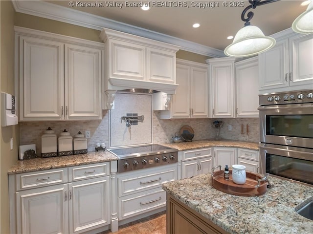 948 Little Coal River Rd, Alum Creek, WV 25003 - kitchen with appliances with stainless steel finishes, white cabinets, ornamental molding, tasteful backsplash, and recessed lighting