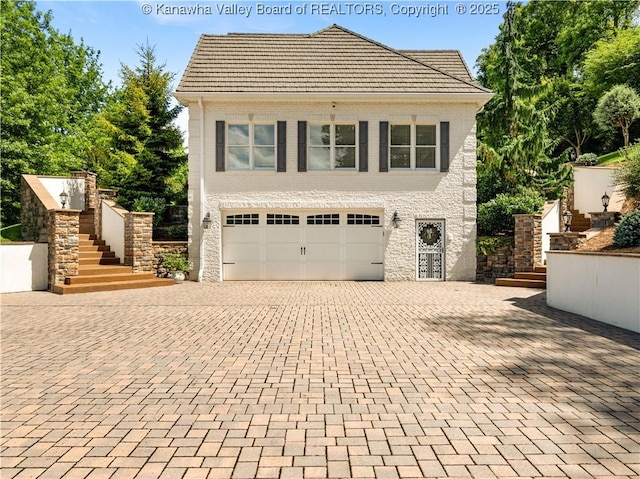 948 Little Coal River Rd, Alum Creek, WV 25003 - view of front facade with stairs, decorative driveway, an attached garage, and a tile roof