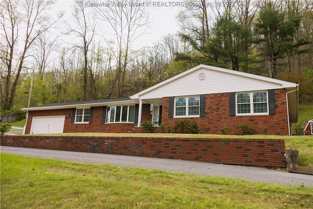 35 Belpac Cir, Logan, WV 25601 - ranch-style home with brick siding and an attached garage