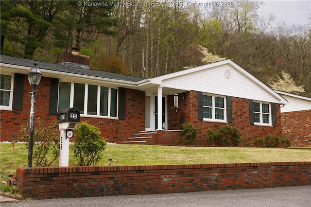 35 Belpac Cir, Logan, WV 25601 - single story home featuring a chimney, brick siding, and a front yard