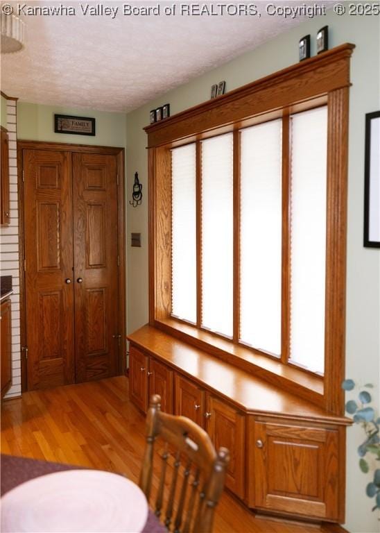 35 Belpac Cir, Logan, WV 25601 - dining area with light wood-style floors and a textured ceiling