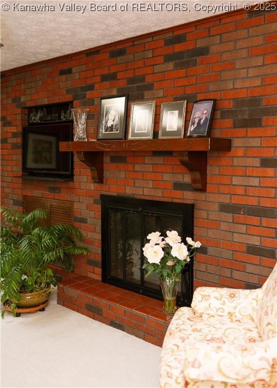 35 Belpac Cir, Logan, WV 25601 - detailed view of a brick fireplace and a textured ceiling
