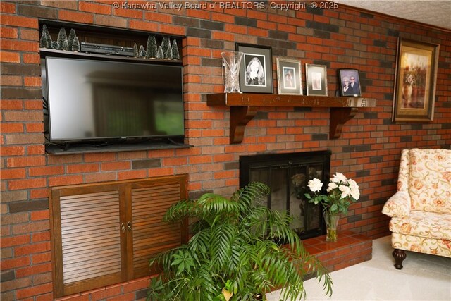 35 Belpac Cir, Logan, WV 25601 - living room featuring a brick fireplace and brick wall