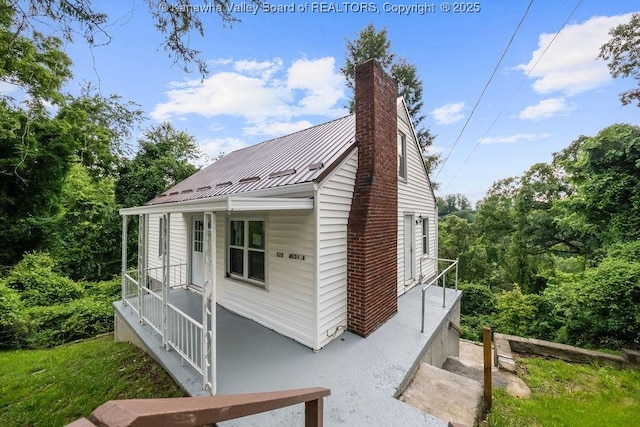 528 Medina St, Charleston, WV 25302 - view of side of property featuring a chimney and a metal roof