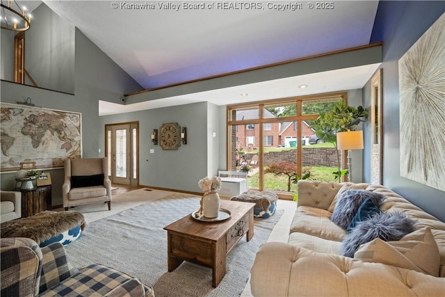 137 Summit Ridge Rd, Hurricane, WV 25526 - living area with light colored carpet, a chandelier, and high vaulted ceiling
