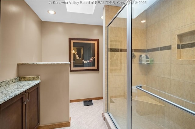 137 Summit Ridge Rd, Hurricane, WV 25526 - full bathroom featuring a skylight, a shower stall, and vanity
