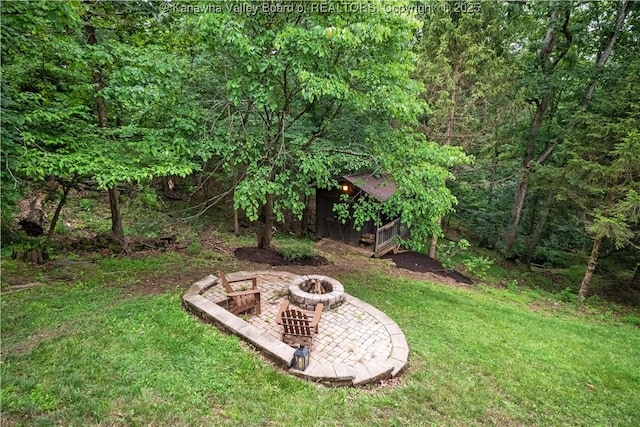 137 Summit Ridge Rd, Hurricane, WV 25526 - view of grassy yard with a fire pit and a wooded view