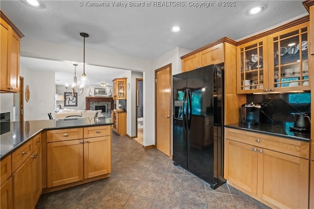 137 Summit Ridge Rd, Hurricane, WV 25526 - kitchen featuring black refrigerator with ice dispenser, dark countertops, glass insert cabinets, tasteful backsplash, and recessed lighting