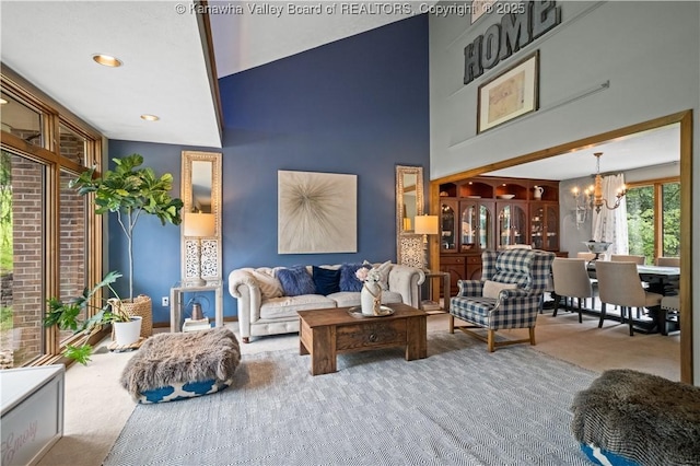 137 Summit Ridge Rd, Hurricane, WV 25526 - carpeted living room with a chandelier and a high ceiling