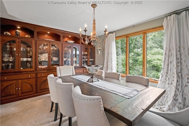 137 Summit Ridge Rd, Hurricane, WV 25526 - dining space with a chandelier and light carpet