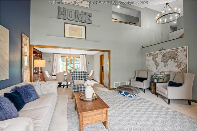 137 Summit Ridge Rd, Hurricane, WV 25526 - carpeted living area featuring a chandelier and a towering ceiling