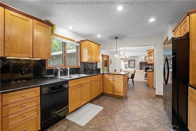 137 Summit Ridge Rd, Hurricane, WV 25526 - kitchen featuring black appliances, a peninsula, open floor plan, tasteful backsplash, and dark countertops