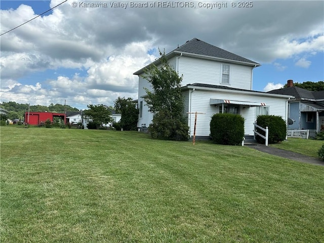 2309 Jefferson Ave, Point Pleasant, WV 25550 - view of side of property featuring a lawn