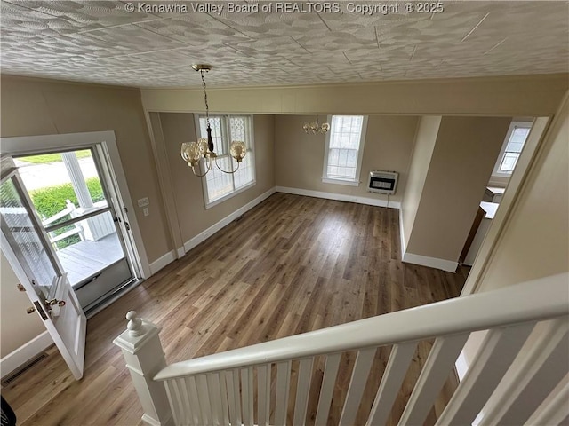 2309 Jefferson Ave, Point Pleasant, WV 25550 - foyer entrance with a chandelier, heating unit, and wood finished floors