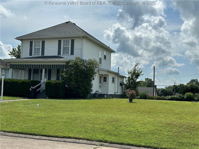 2309 Jefferson Ave, Point Pleasant, WV 25550 - view of front of house featuring a front lawn, a porch, and a shingled roof