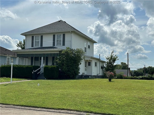 2309 Jefferson Ave, Point Pleasant, WV 25550 - view of front of house with a front yard, covered porch, and roof with shingles