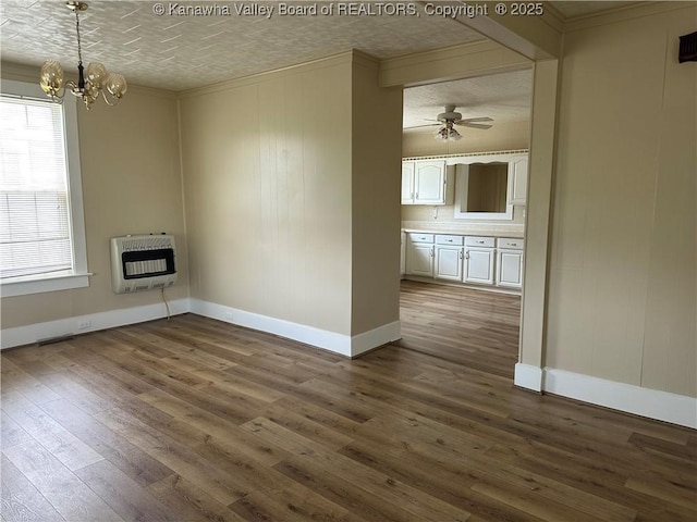 2309 Jefferson Ave, Point Pleasant, WV 25550 - unfurnished living room with heating unit, ornamental molding, dark wood-style floors, a chandelier, and ceiling fan