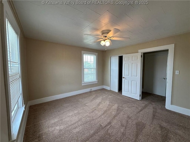 2309 Jefferson Ave, Point Pleasant, WV 25550 - unfurnished bedroom with carpet, a closet, and ceiling fan