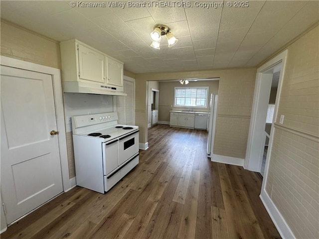 2309 Jefferson Ave, Point Pleasant, WV 25550 - kitchen with white appliances, under cabinet range hood, white cabinetry, dark wood-type flooring, and brick wall