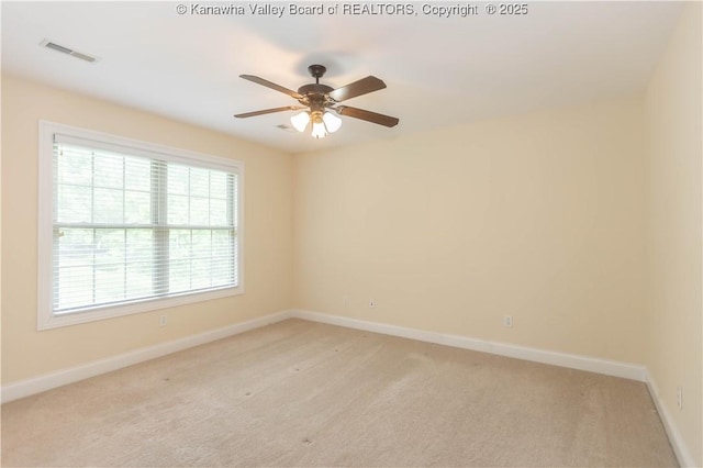 705 Christian Dr, Charleston, WV 25314 - spare room featuring healthy amount of natural light, ceiling fan, and light colored carpet