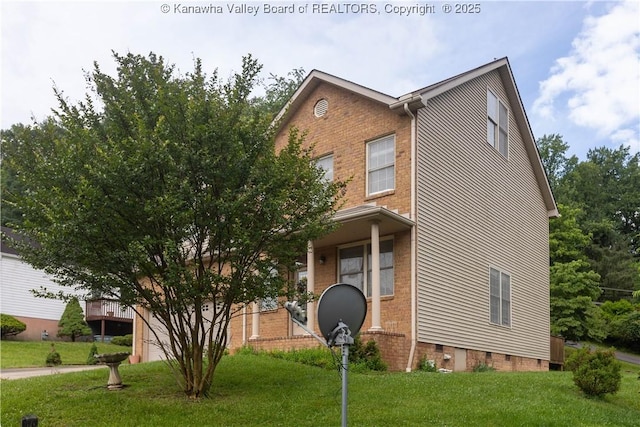 705 Christian Dr, Charleston, WV 25314 - view of front of home featuring a front yard, brick siding, and crawl space