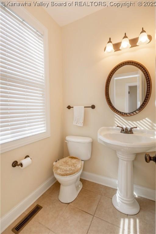705 Christian Dr, Charleston, WV 25314 - bathroom featuring toilet and tile patterned flooring