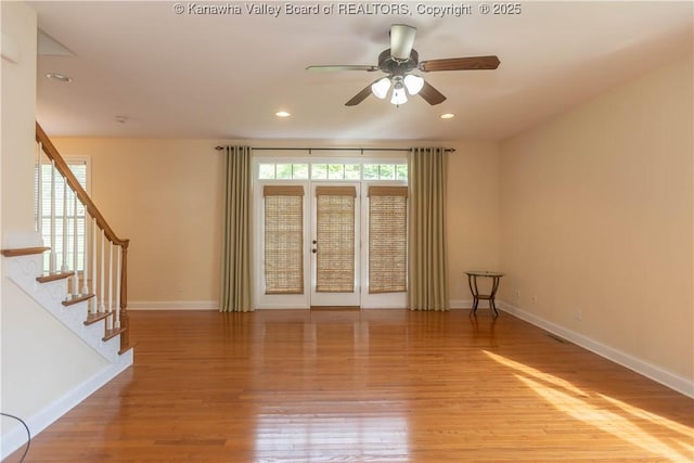 705 Christian Dr, Charleston, WV 25314 - unfurnished room featuring wood finished floors, stairs, a ceiling fan, and recessed lighting