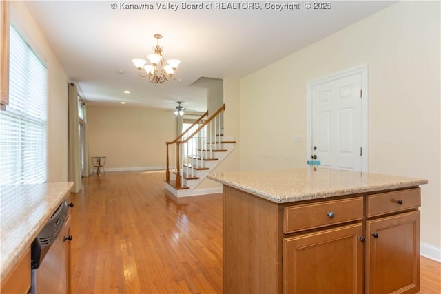 705 Christian Dr, Charleston, WV 25314 - kitchen featuring stainless steel dishwasher, a chandelier, light wood finished floors, pendant lighting, and a ceiling fan