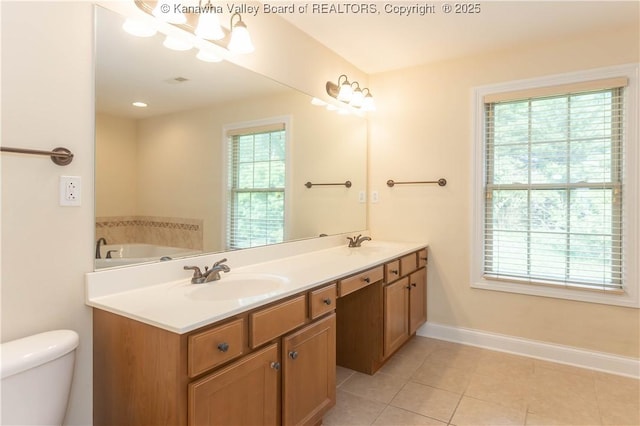 705 Christian Dr, Charleston, WV 25314 - full bathroom featuring double vanity, tile patterned floors, and a tub to relax in