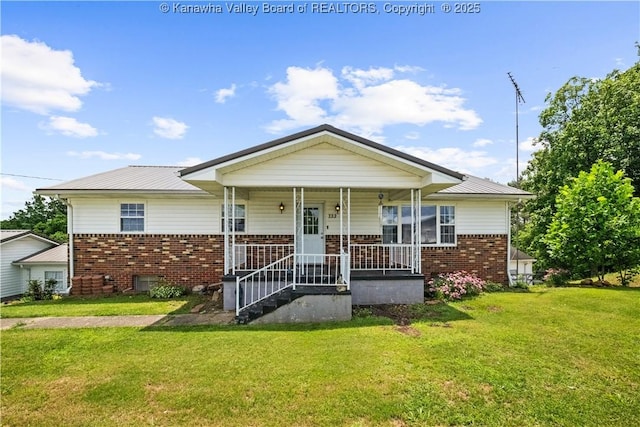 733 Divide Ridge Rd, Given, WV 25245 - bungalow-style home with brick siding, a front lawn, covered porch, and a metal roof