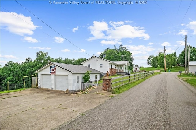 733 Divide Ridge Rd, Given, WV 25245 - view of front of property with a garage and a metal roof