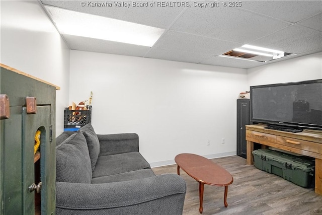 733 Divide Ridge Rd, Given, WV 25245 - living room featuring wood finished floors and a drop ceiling
