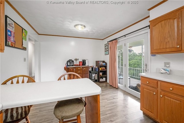 733 Divide Ridge Rd, Given, WV 25245 - dining space with crown molding and light wood-style flooring