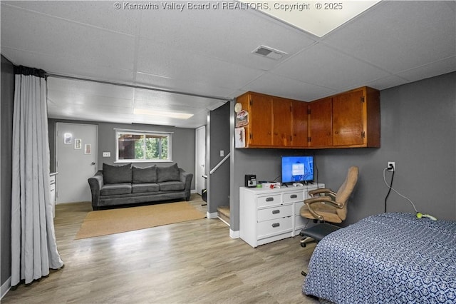 733 Divide Ridge Rd, Given, WV 25245 - bedroom with a paneled ceiling and light wood finished floors