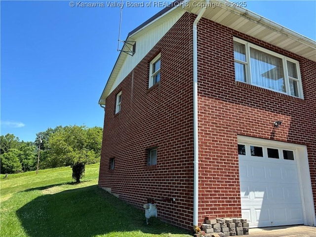 123 2nd St, Burnsville, WV 26335 - view of side of home with an attached garage, brick siding, and a yard