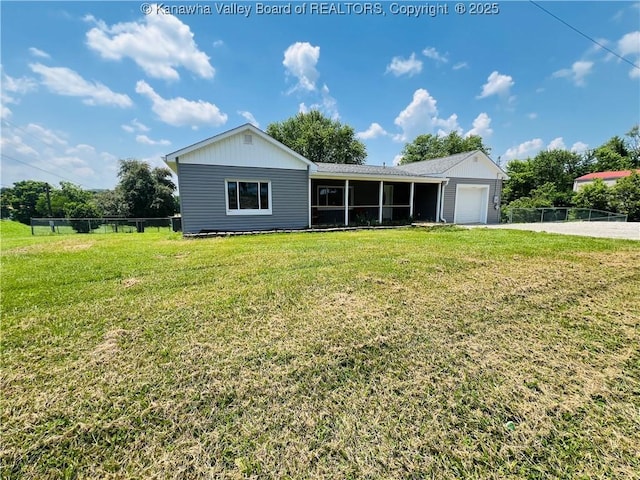 2635 Greenhills Rd, Ravenswood, WV 26164 - view of front facade featuring a garage, driveway, and a sunroom