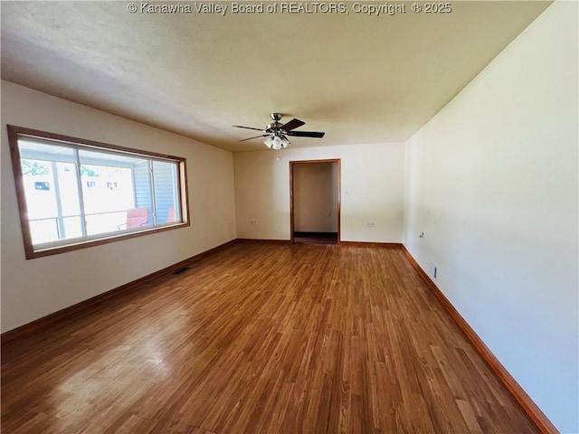2635 Greenhills Rd, Ravenswood, WV 26164 - spare room with wood finished floors and ceiling fan