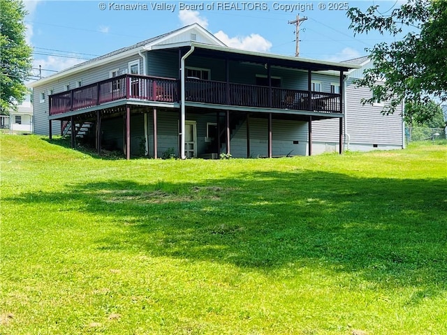 2635 Greenhills Rd, Ravenswood, WV 26164 - back of house with a wooden deck and a lawn