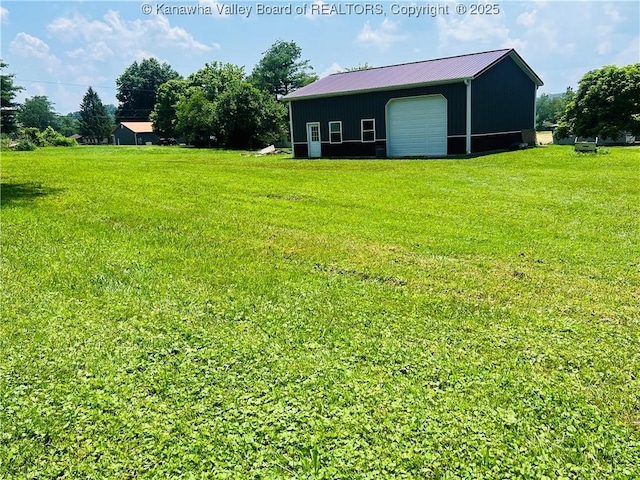 2635 Greenhills Rd, Ravenswood, WV 26164 - view of green lawn featuring an outbuilding and a garage