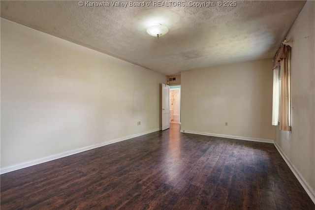 2620 Bard Ave, Saint Albans, WV 25177 - empty room with dark wood-style floors and a textured ceiling