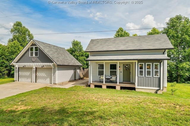 4862 Mont Union Rd, Fraziers Bottom, WV 25082 - view of front of property featuring an outbuilding, a porch, a front lawn, a detached garage, and a shingled roof