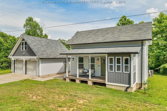 4862 Mont Union Rd, Fraziers Bottom, WV 25082 - view of front of house with covered porch, a front lawn, board and batten siding, and a garage