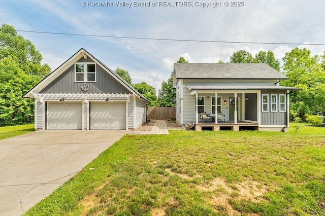 4862 Mont Union Rd, Fraziers Bottom, WV 25082 - view of front of home with covered porch, board and batten siding, and a garage
