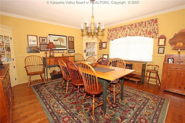 5445 Longview Dr, Cross Lanes, WV 25313 - dining area featuring crown molding, a chandelier, and wood finished floors