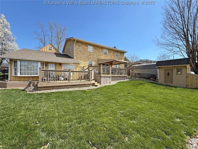 5445 Longview Dr, Cross Lanes, WV 25313 - rear view of house featuring a deck, board and batten siding, a lawn, and a storage shed