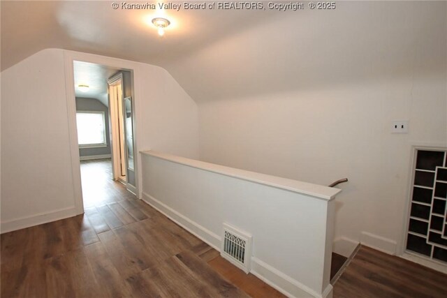 4312 Lancaster Ave, Charleston, WV 25304 - corridor with vaulted ceiling, wood finished floors, and an upstairs landing